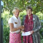 therese desmond oc ceo accepts donation from metropolitan golf course