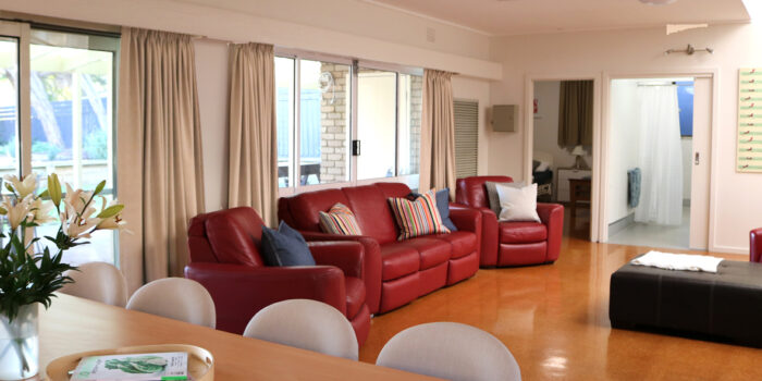 tootgarook accessible family holiday house second loungeroom with red 3 seater couch and 2 one seaters