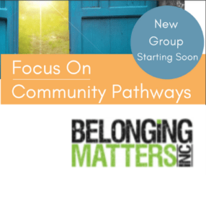 Belonging Matters logo in front of a door and sign that reads Focus on Community Pathways