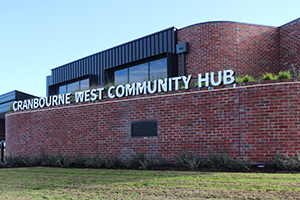 A brick building with the sign Cranbourne West Community Hub