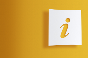 A cut out letter i in front of a yellow background