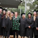 Graduates of Dual Diploma stand smiling with their course facilitator Maree O'Dwyer from Academy of Healthcare.