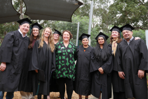 Graduates of Dual Diploma stand smiling with their course facilitator Maree O'Dwyer from Academy of Healthcare.